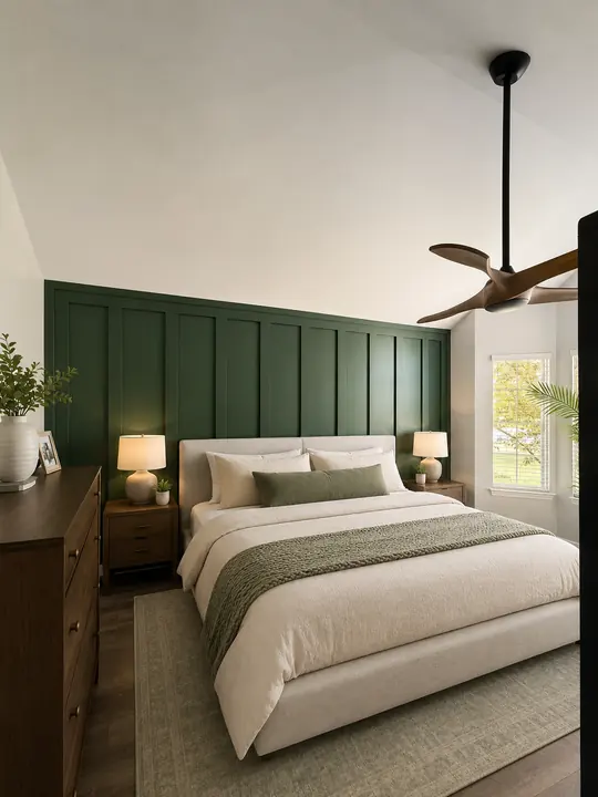 Bedroom with deep green board and batten accent wall